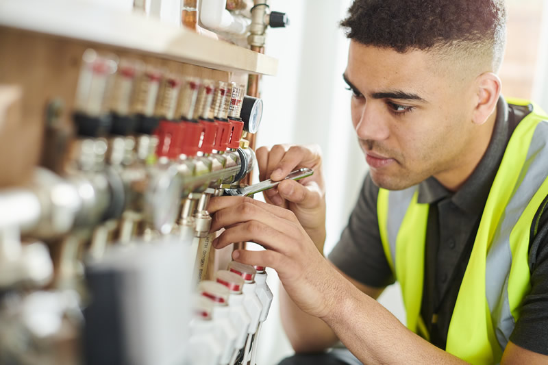 worker fitting valves and pipes